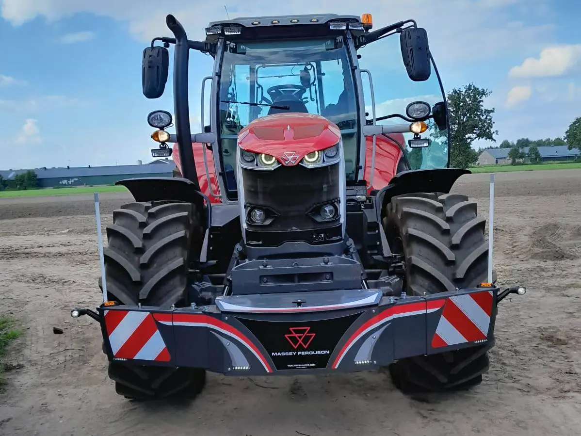 Box 50L without front linkage mounted on a tractor, with reflective stripes and safety marker poles visible