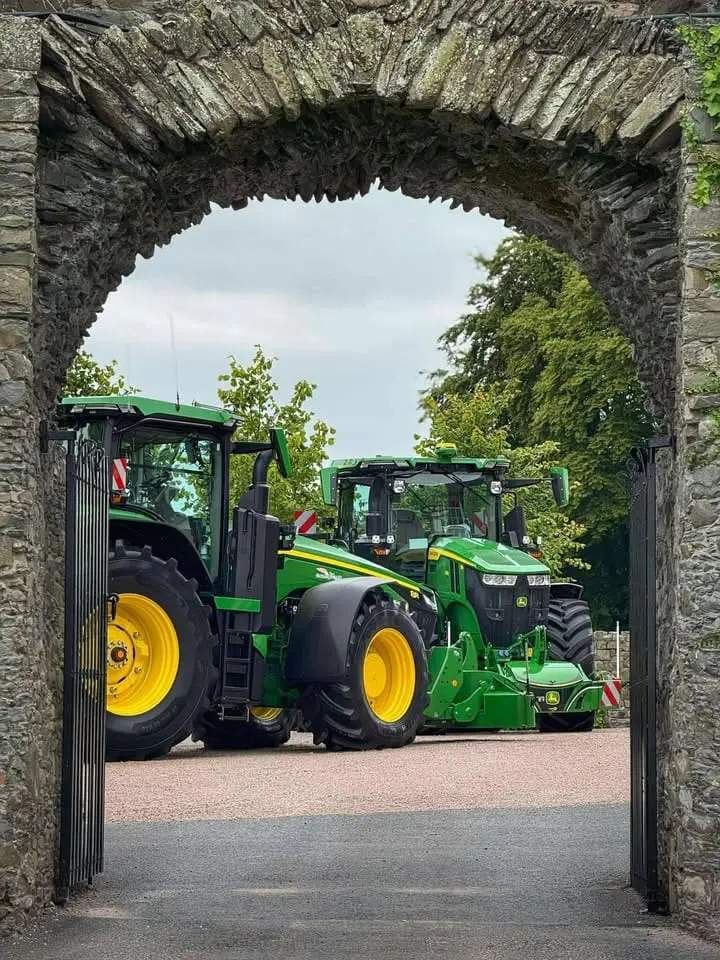 John Deere tractor with a TractorBumper front bumper and rear weight