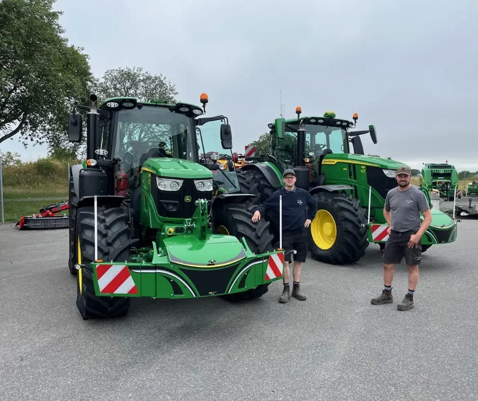John Deere tractor with a TractorBumper front bumper and rear weight