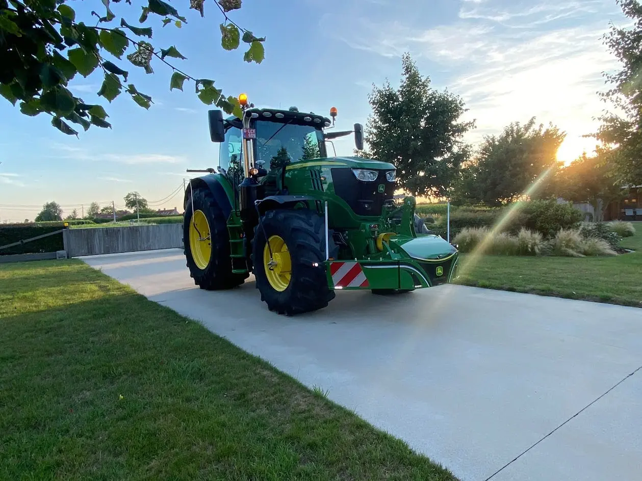John Deere tractor with a TractorBumper front bumper and rear weight