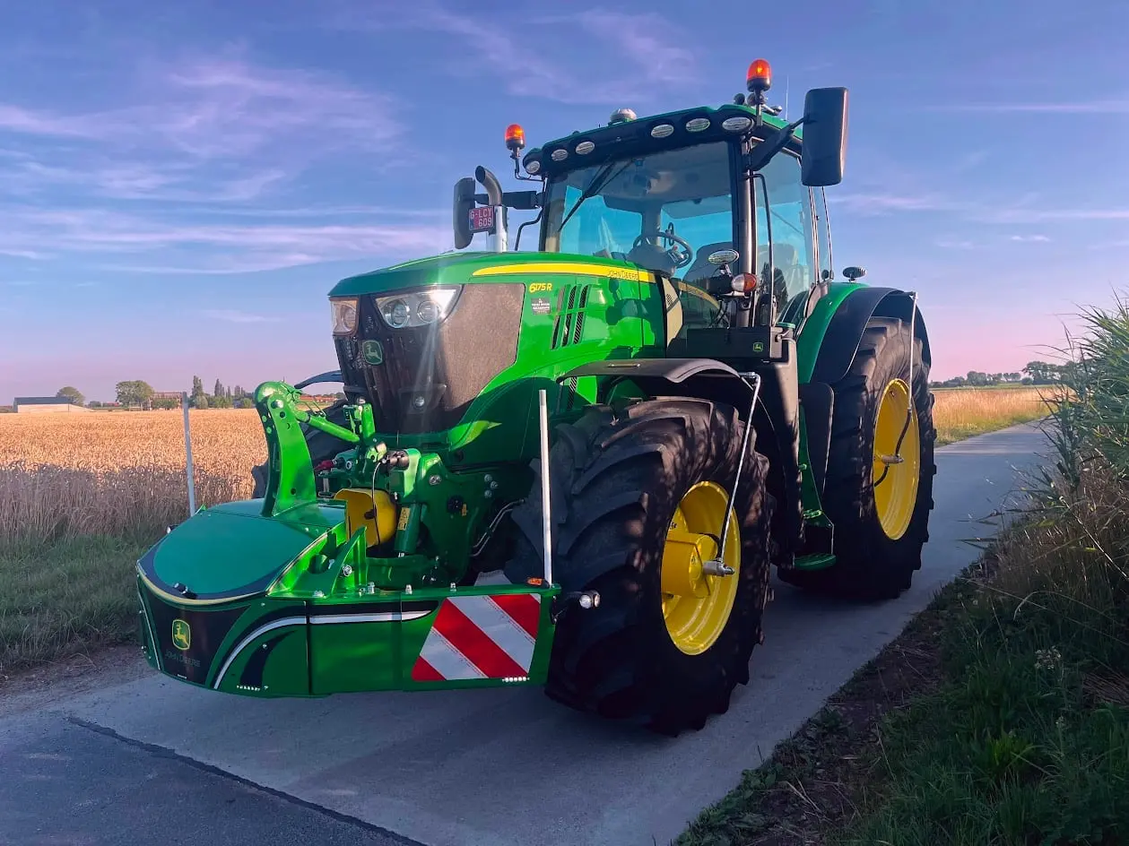 John Deere tractor with a TractorBumper front bumper and rear weight
