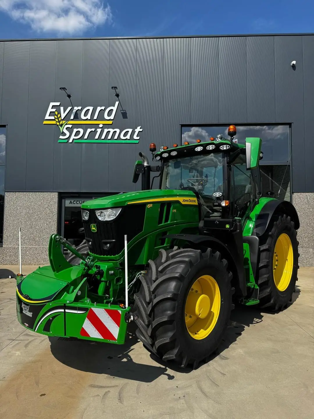 John Deere tractor with a TractorBumper front bumper and rear weight