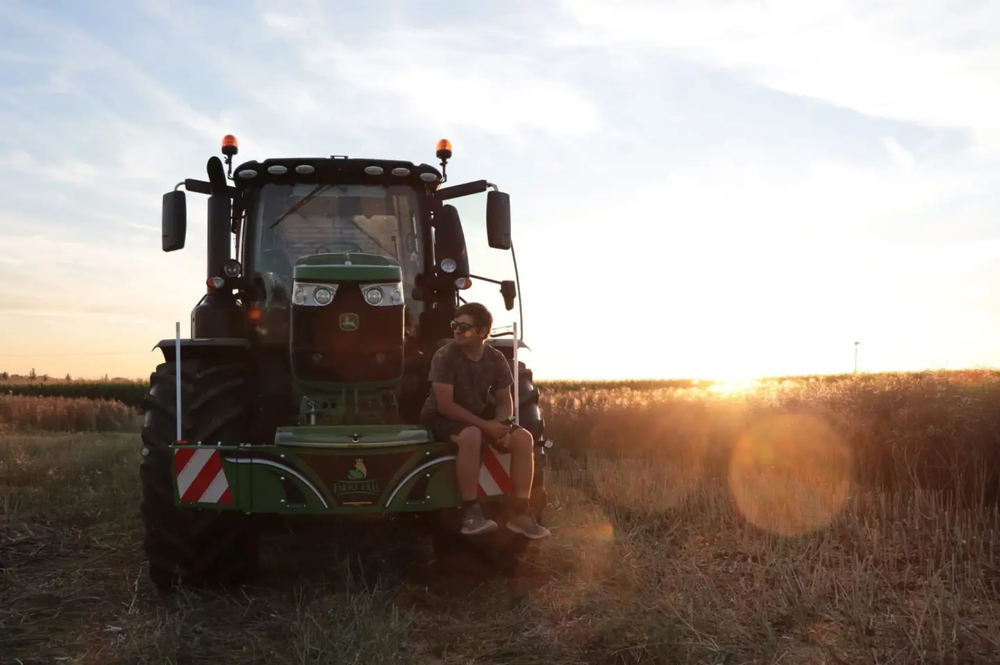 John Deere tractor with a TractorBumper front bumper and rear weight
