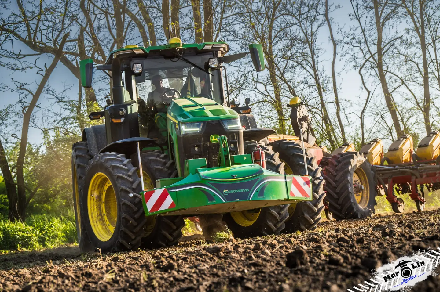 John Deere tractor with a TractorBumper front bumper and rear weight