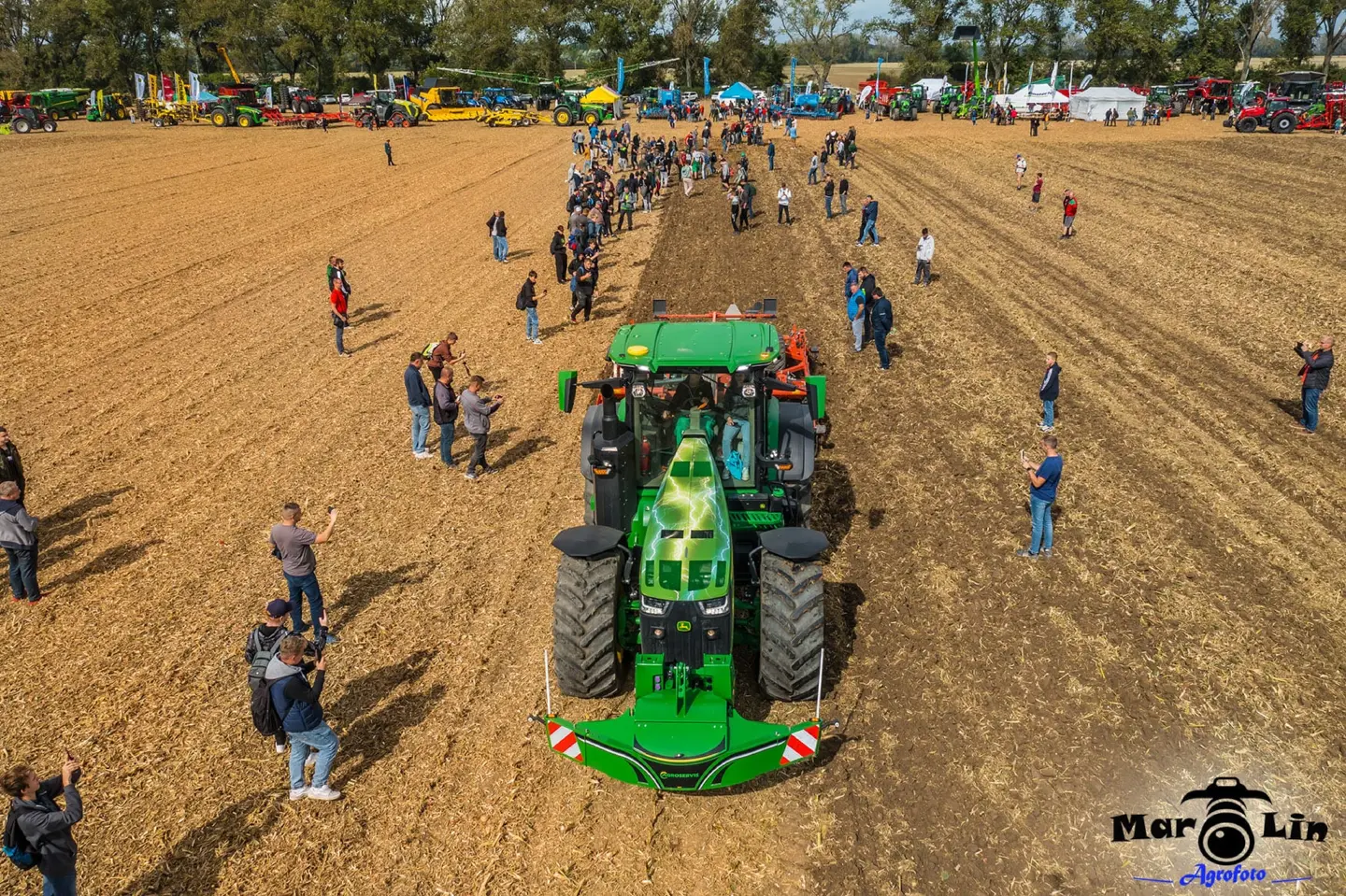 John Deere tractor with a TractorBumper front bumper and rear weight