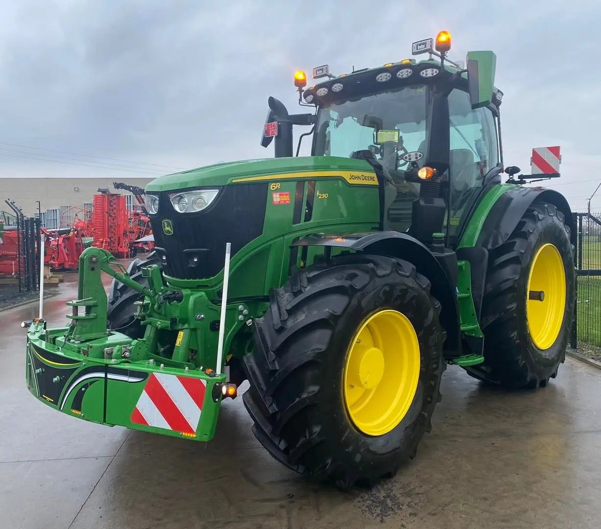 John Deere tractor with a TractorBumper front bumper and rear weight