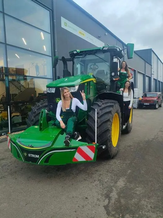 John Deere tractor with a TractorBumper front bumper and rear weight