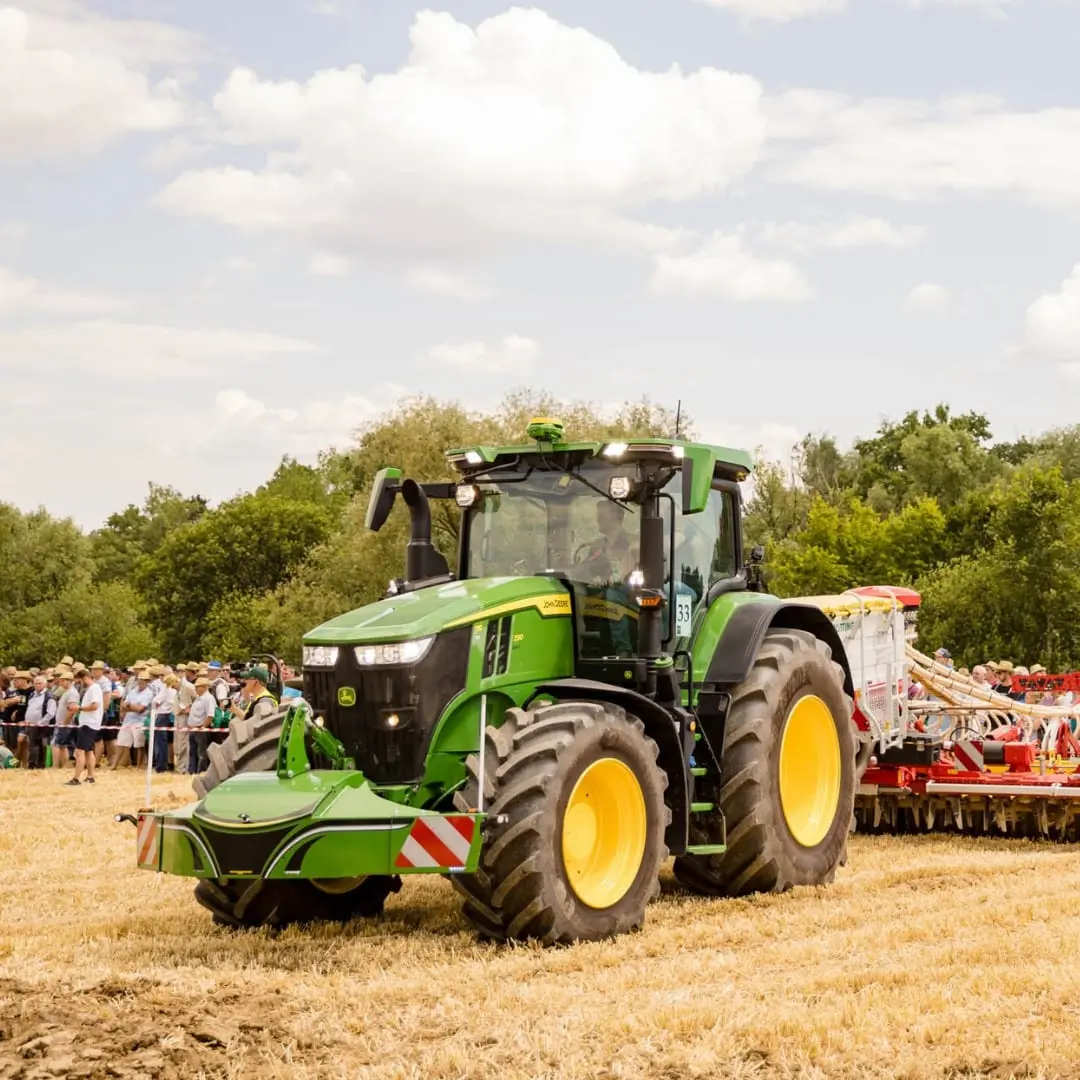 John Deere tractor with a TractorBumper front bumper and rear weight