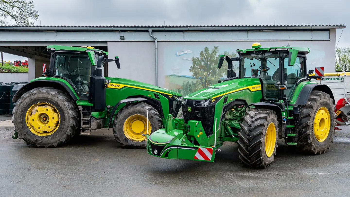John Deere tractor with a TractorBumper front bumper and rear weight